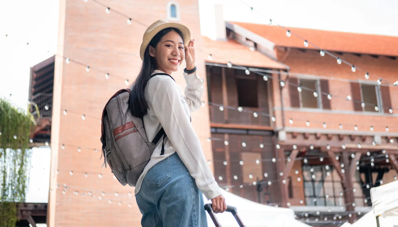 Traveller with luggage at destination